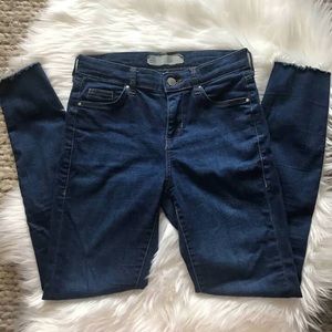 Cute skinny jeans with fringe bottoms.